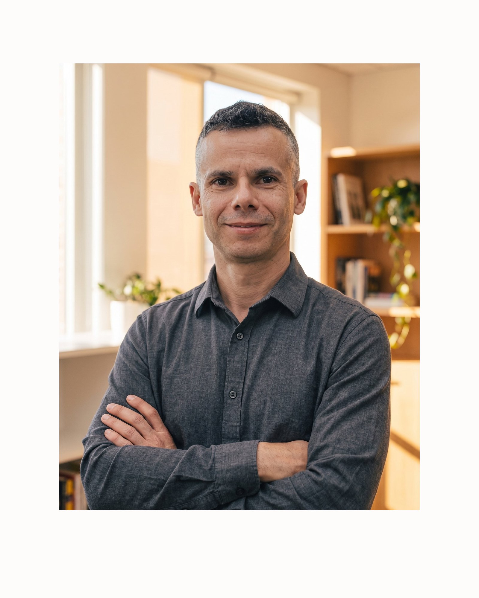 Eddie Roman, owner of R Squared, clean-shaven in a warm office.